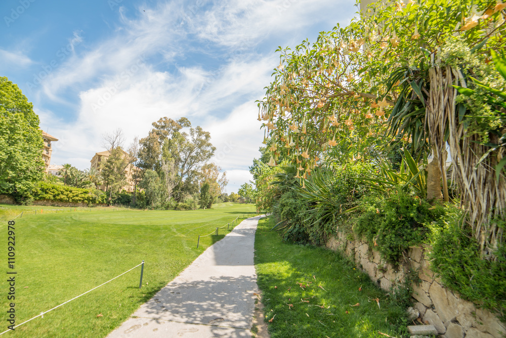 Golf course landscape with trees and flowers