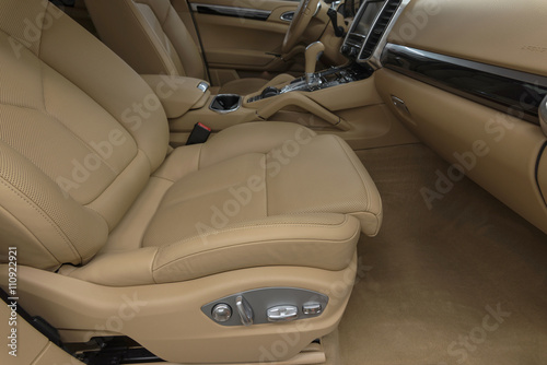Prestige car interior background. Passenger leather seat. © alexdemeshko
