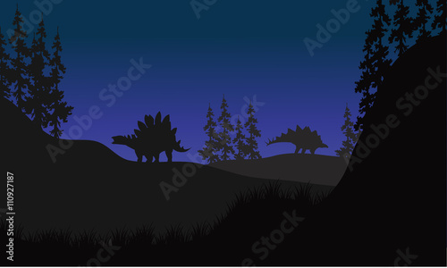 stegosaurus in fields scenery at night
