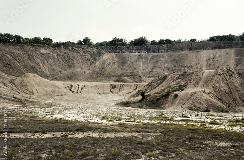 Abandoned quarry chasm photo