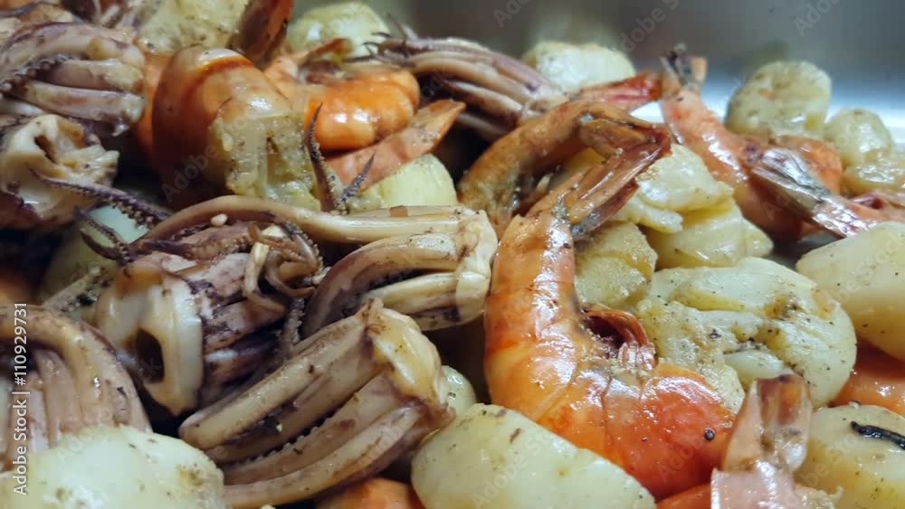 Closeup scallop, shrimp and octopus seafood, at a restaurant kitchen Closeup scallop, shrimp and octopus seafood, at a restaurant kitchen