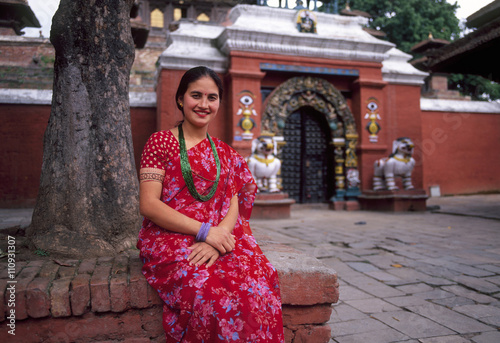 Portrait of Nepalese woman sitting outside temple, Kathmandu, Nepal