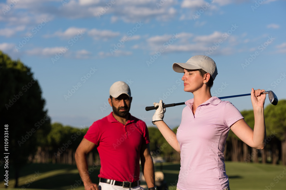 portrait of couple on golf course portrait of couple on golf course