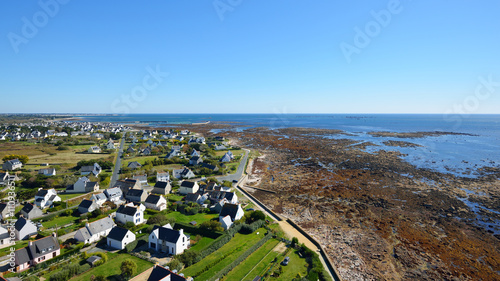 Aerial view of cottages and ocean coast in Brittany, France photo