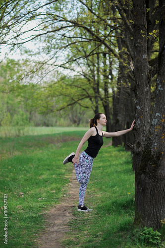 girl doing stretching outdoors