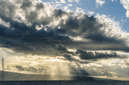 Seascape of sunbeams and storm clouds, Maui, Hawaii photo