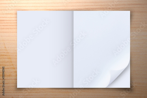 Open blank paper on wooden background, Top view