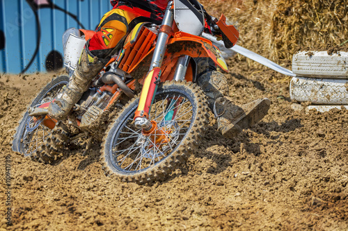Motocross rider plowing through mud