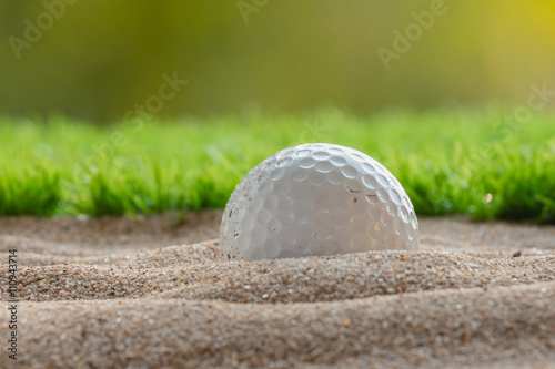 Фотография Golf ball in sand bunker