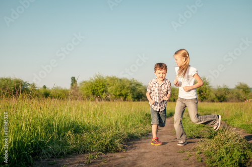 Two happy children  playing on the road © altanaka