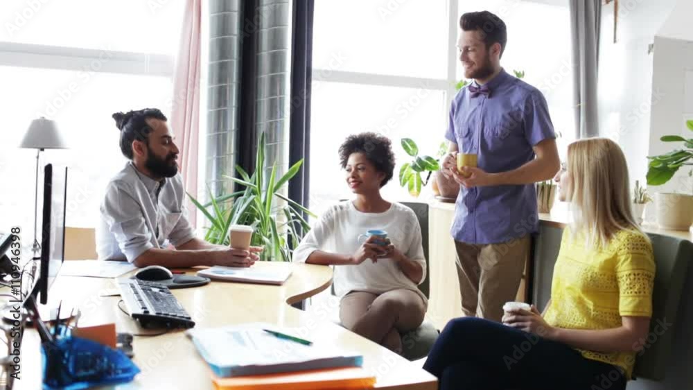 happy creative team drinking coffee in office happy creative team drinking coffee in office