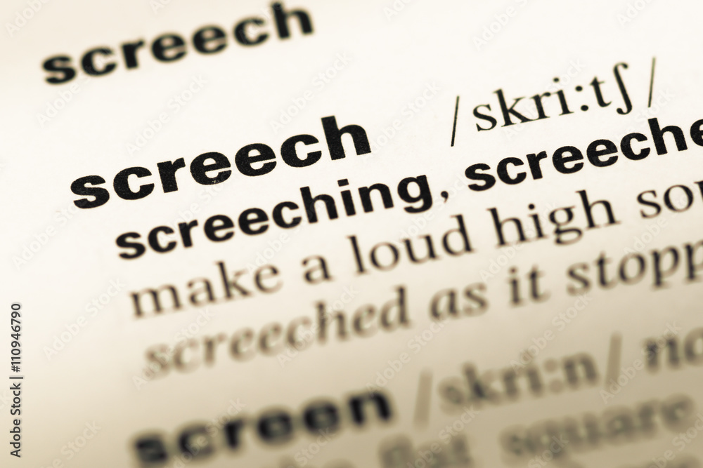 Close up of old English dictionary page with word screech Close up of old English dictionary page with word screech