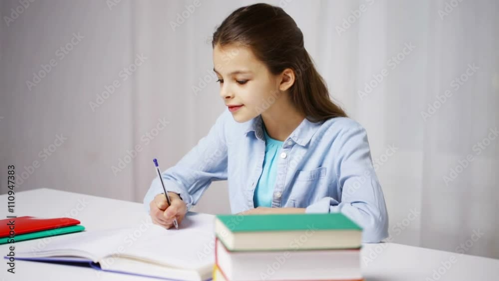 happy school girl with books and notepad at home happy school girl with books and notepad at home