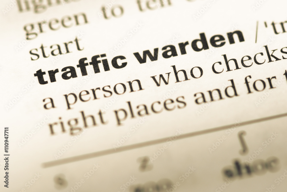 Close up of old English dictionary page with word traffic warden Close up of old English dictionary page with word traffic warden
