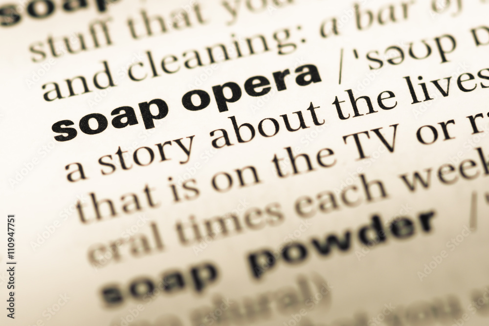 Close up of old English dictionary page with word soap opera Close up of old English dictionary page with word soap opera