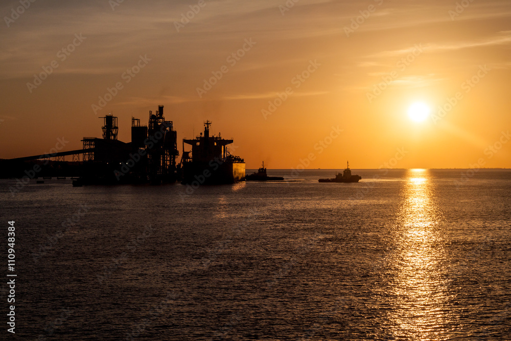 Silhouettes of ship and cranes in a port of Santarem city, Brazil