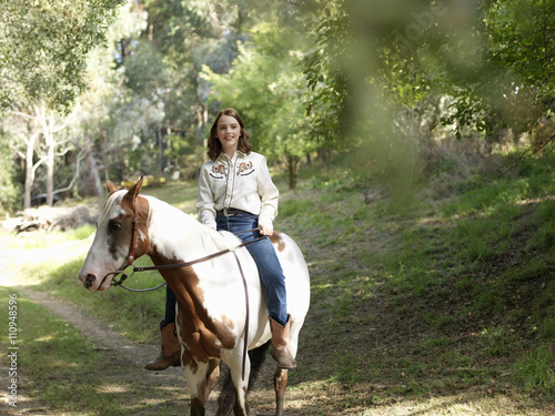 Portrait of teenage girl bareback riding horse