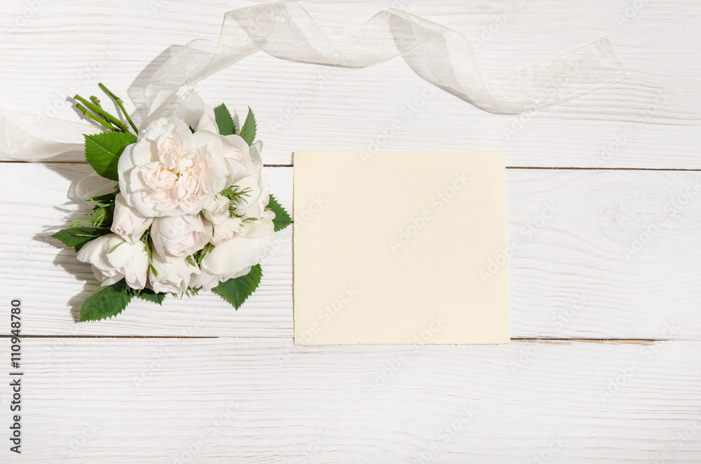 white roses with empty card for you text on white table.top view white roses with empty card for you text on white table.top view