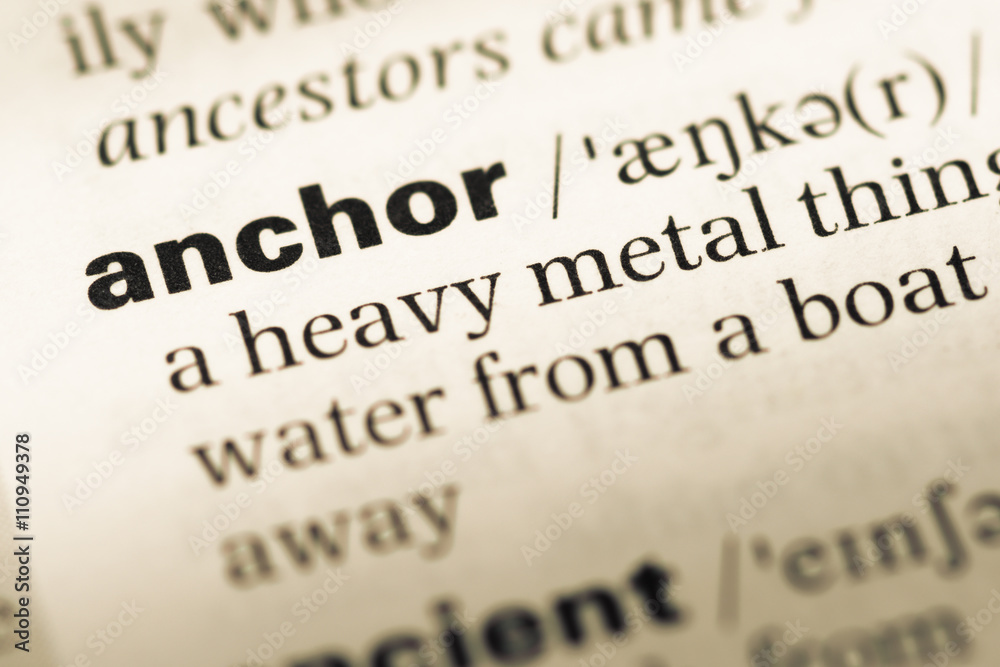 Close up of old English dictionary page with word anchor Close up of old English dictionary page with word anchor