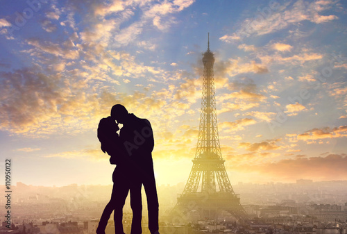 silhouette of romantic lovers with eiffel tower in Paris with sunset © sergeialyoshin