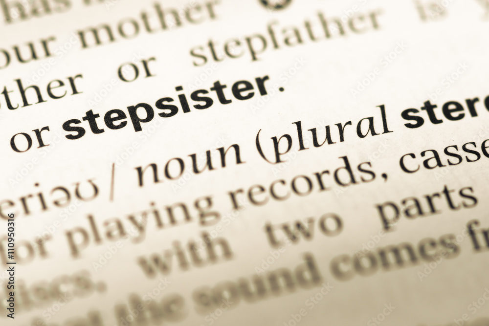 Close up of old English dictionary page with word stepsister Close up of old English dictionary page with word stepsister