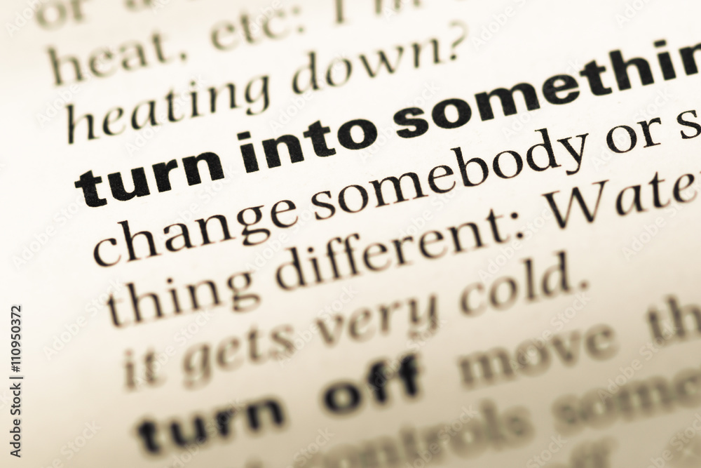 Close up of old English dictionary page with word turn into Close up of old English dictionary page with word turn into