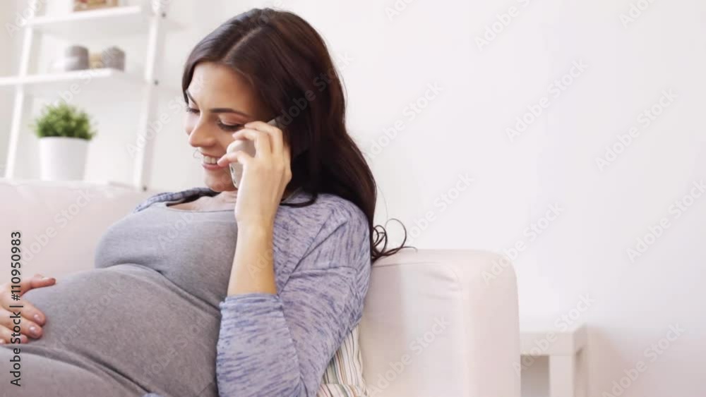happy pregnant woman calling on smartphone at home