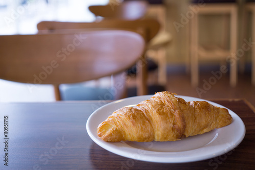 croissants in white plate on the table