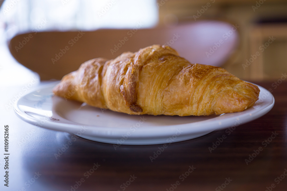 croissants in white plate on the table