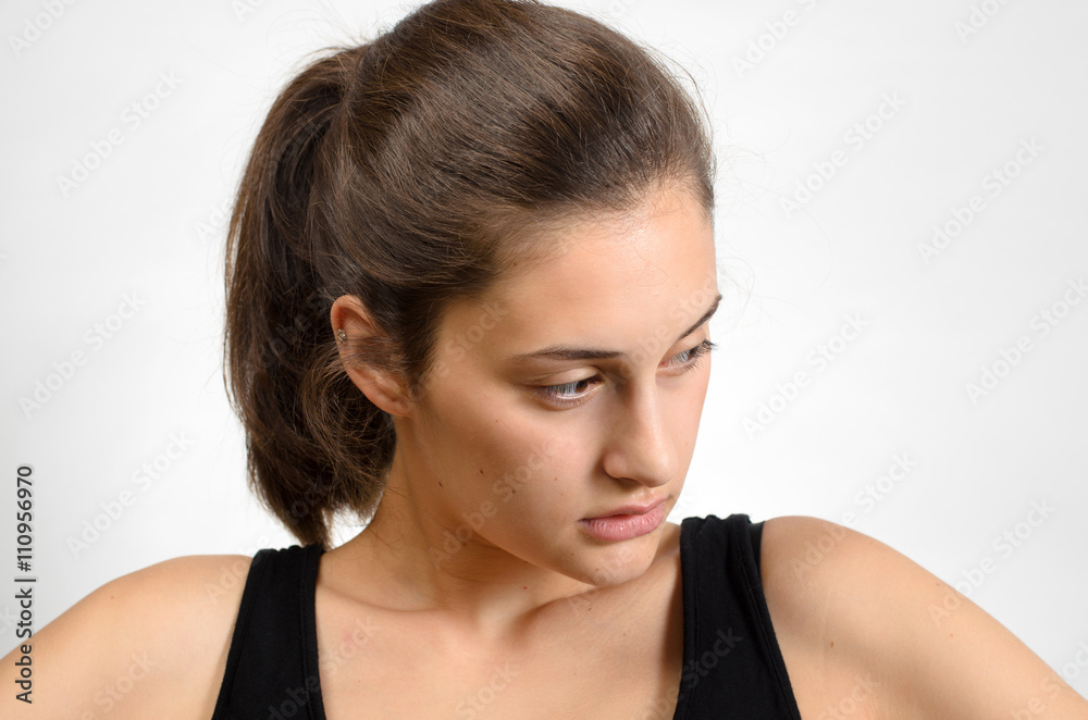 beautiful girl thinkink thoughts on a gray background