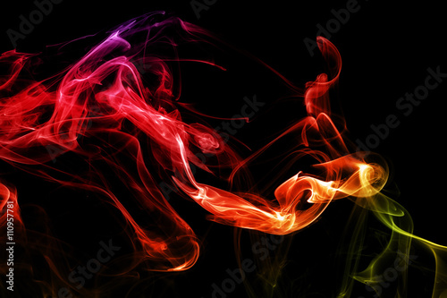 Colored abstract smoke, isolated on black background. Photo. Acid neon color.