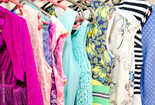 Women's dresses on hangers © svetamart