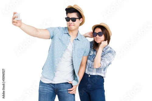 Happy young couple taking a selfie