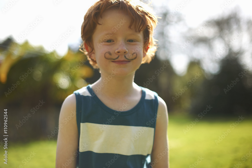 © Connect Images - Portrait of young boy with drawn on moustache