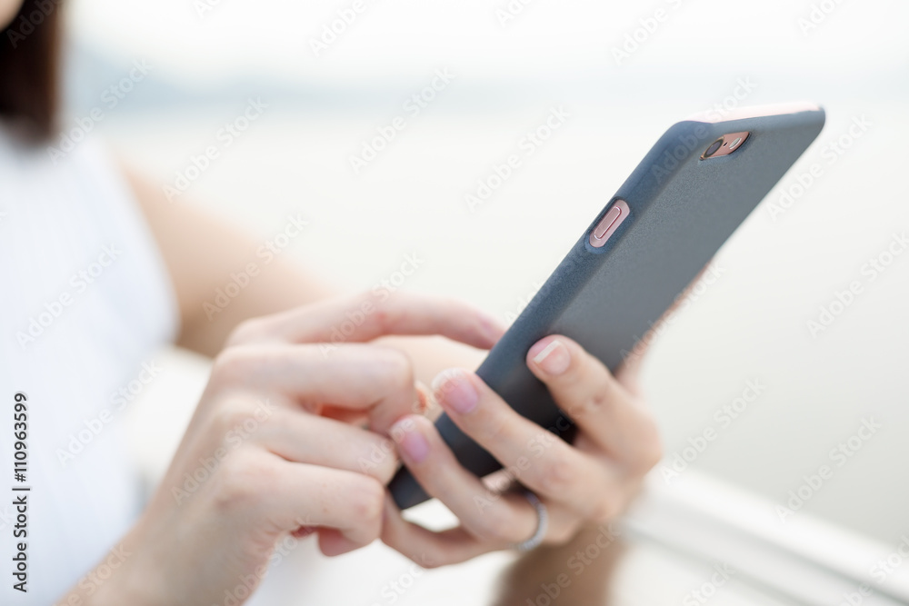 Woman using cellphone at outdoor Woman using cellphone at outdoor