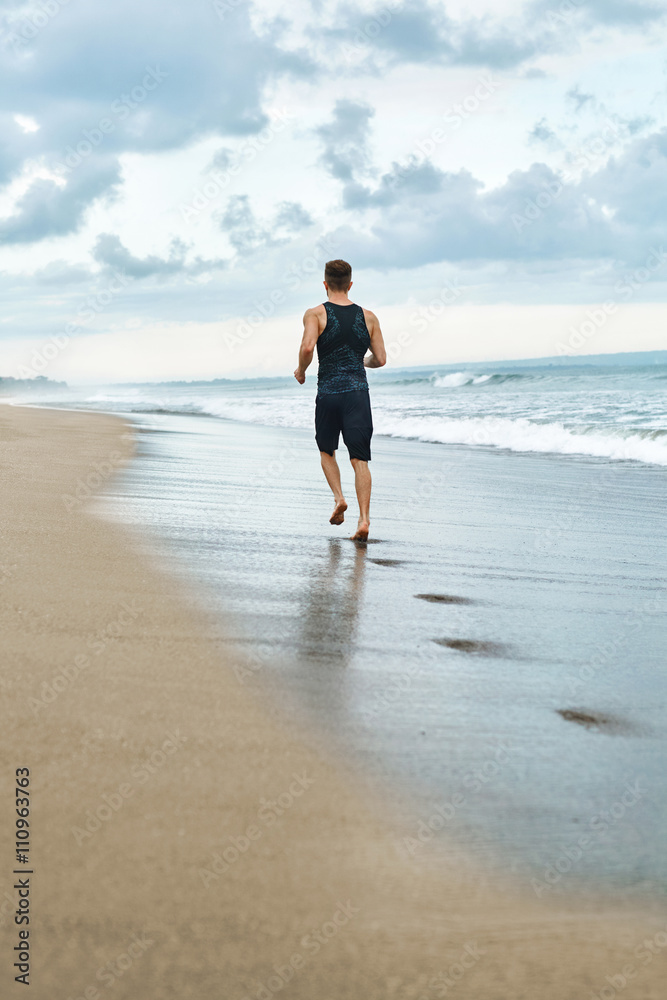 Fitness. Fit Athletic Man Running On Beach. Jogger Exercising And Training For Marathon. Sporty Runner Jogging Near Sea During Outdoor Workout. Sports, Healthy Active Lifestyle Concept