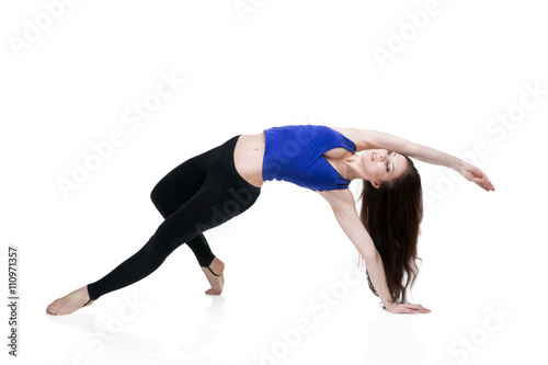 ?oung beautiful caucasian woman in yoga pose in studio isolated on white background