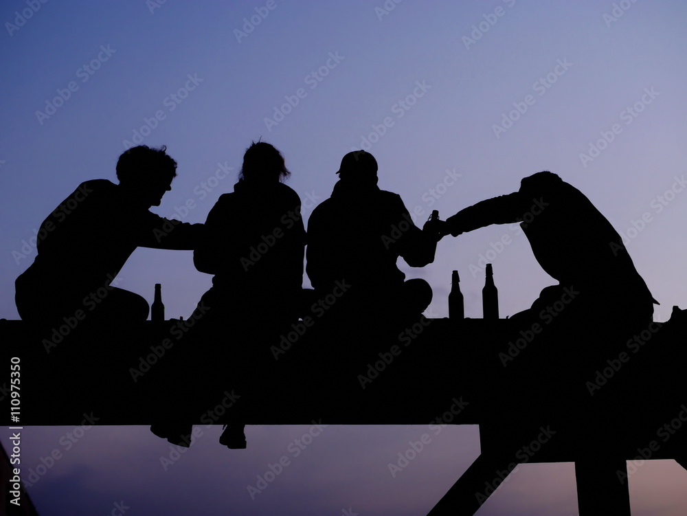 Silhouette of four friend