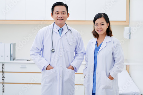 Portrait of smiling doctor and nurse looking at camera