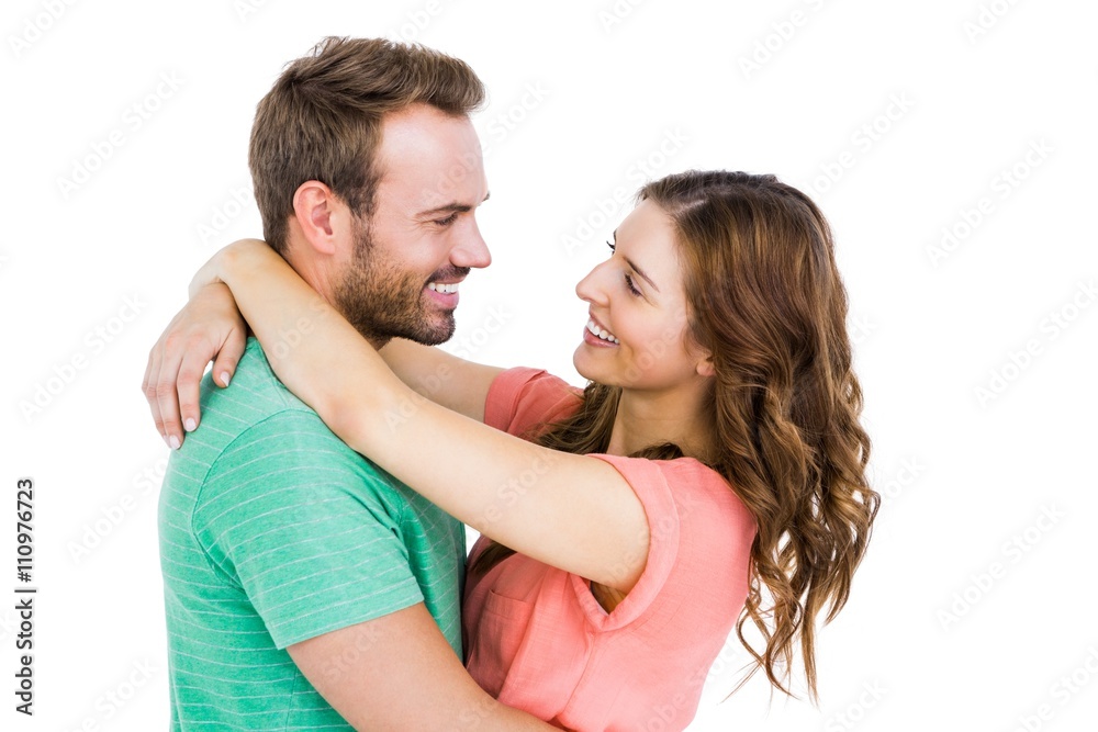 Happy young couple cuddling each other
