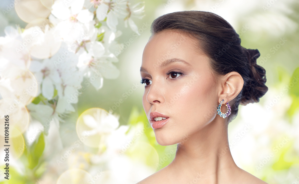close up of beautiful woman face with earring close up of beautiful woman face with earring