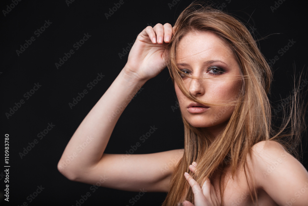Young woman with fresh skin looking at camera