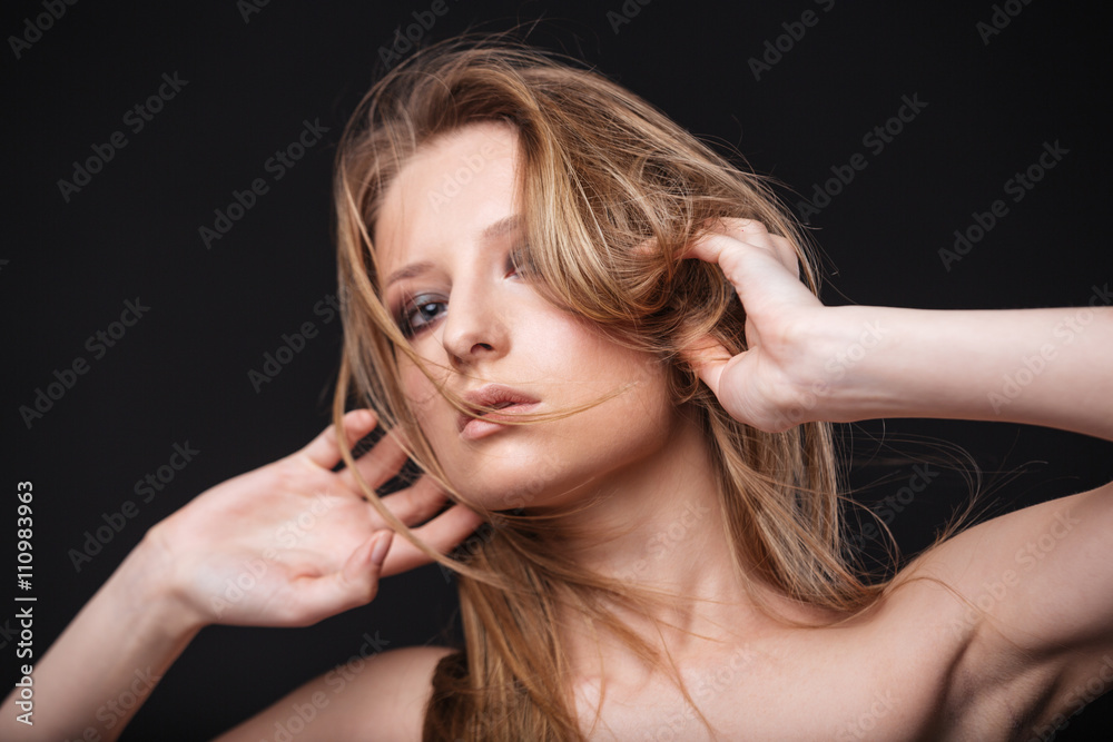 Naklejka premium Lovely woman with fresh skin looking at camera