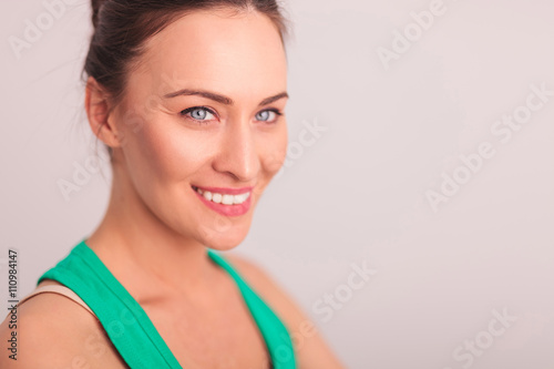 side of a smiling woman's face looking away
