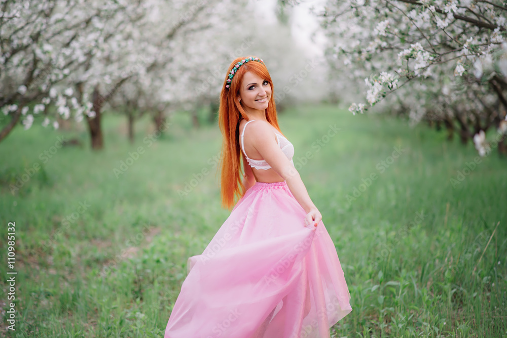 young beautiful woman in the lush spring garden young beautiful woman in the lush spring garden
