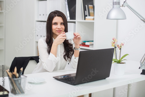 Business woman with notebook in office, workplace © naataali
