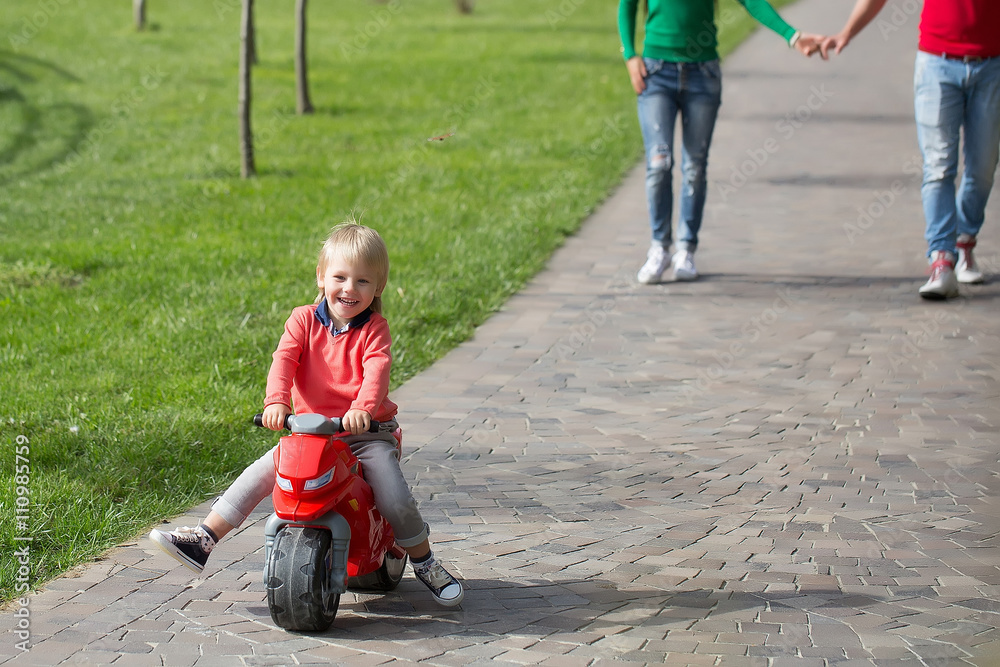 Happy boy on toy bike Happy boy on toy bike