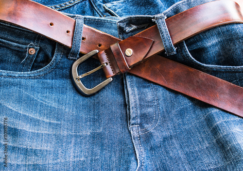 Beautiful blue jeans with leather belt