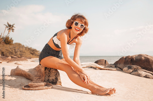 attractive young woman in bikini on the beach