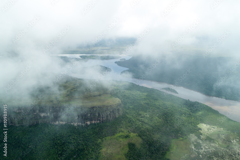Aerial view of river Caroni and one of the tepuis (table mountains) in Venezuela